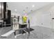 Bright kitchen featuring granite countertops, stainless steel sink and appliances and an adjoining dining area at 1321 Custer Bayou St, Ruskin, FL 33570