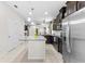 Open kitchen with granite countertops, an island, stainless steel appliances and dark cabinets at 1321 Custer Bayou St, Ruskin, FL 33570