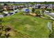 Community playground with a splash of color surrounded by a well-maintained lawn, and benches at 1321 Custer Bayou St, Ruskin, FL 33570
