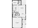 Open-concept first-floor layout featuring a spacious great room, dining area, kitchen, and two-car garage at 13221 Tropical Breeze Way, Hudson, FL 34669