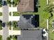 Aerial view of a neighborhood home with solar panels at 13903 Sage Thrasher Ln, Riverview, FL 33579