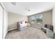 Comfortable bedroom features a window, a comfortable trundle bed, a ceiling fan, and soft carpet at 13903 Sage Thrasher Ln, Riverview, FL 33579