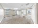 Large bonus room features neutral carpet, recessed lighting and plenty of natural light at 13903 Sage Thrasher Ln, Riverview, FL 33579