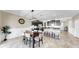 Stylish eat-in kitchen featuring dark wood cabinets and a breakfast bar with granite countertop at 13903 Sage Thrasher Ln, Riverview, FL 33579