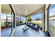 Screened patio includes contemporary seating with backyard views at 13903 Sage Thrasher Ln, Riverview, FL 33579
