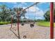Neighborhood playground featuring swings and other play equipment, with wood chip ground covering at 13903 Sage Thrasher Ln, Riverview, FL 33579
