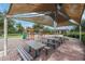Shaded playground area featuring picnic tables and various play structures at 13903 Sage Thrasher Ln, Riverview, FL 33579