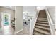 View from the first floor showing open living area and carpeted stairs at 13903 Sage Thrasher Ln, Riverview, FL 33579