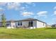 The backyard offers a patio, green space, and great outdoor living, with modern architecture at 13958 Richland Gulf Cir, Parrish, FL 34219