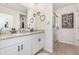 Ensuite bathroom featuring double sinks with granite countertops and a glass enclosed walk-in shower at 13958 Richland Gulf Cir, Parrish, FL 34219