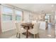Bright dining area with a round table, comfortable seating, and natural light, perfect for Gathering meals at 13958 Richland Gulf Cir, Parrish, FL 34219