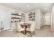 Inviting dining area with a round table, stylish chairs, and decor, creating a cozy and functional space at 13958 Richland Gulf Cir, Parrish, FL 34219