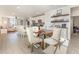 Open-concept dining area flowing into the kitchen and living room, perfect for entertaining guests at 13958 Richland Gulf Cir, Parrish, FL 34219
