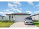Charming single-story home with a well-manicured lawn and inviting curb appeal, perfect for a starter Gathering at 13958 Richland Gulf Cir, Parrish, FL 34219