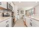 Bright kitchen with stainless steel appliances, granite countertops, and stylish tile backsplash at 13958 Richland Gulf Cir, Parrish, FL 34219