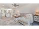 Spacious living room featuring an open layout, seamlessly connected to the kitchen with an island bar at 13958 Richland Gulf Cir, Parrish, FL 34219