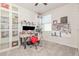 Home office with carpet, a large window, a work desk, and multiple decorative shelving units at 13958 Richland Gulf Cir, Parrish, FL 34219