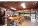 Rustic bar area with wooden accents, seating, and a full bar setup at 14840 Shipwatch Trce # 1924, Largo, FL 33774