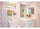 Bright bathroom with a large mirror, vanity, and fresh towels on the rack at 14840 Shipwatch Trce # 1924, Largo, FL 33774