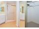 Spacious bathroom featuring a glass-enclosed shower with bright tiles, a walk in closet and bright decor at 14840 Shipwatch Trce # 1924, Largo, FL 33774