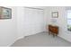 Neutral bedroom features a closet, small window, and a charming wooden dresser at 14840 Shipwatch Trce # 1924, Largo, FL 33774