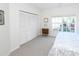 A cozy bedroom featuring a window, closet, and a comfortable bed for relaxing and resting at 14840 Shipwatch Trce # 1924, Largo, FL 33774