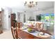 Open dining area with elegant furnishings and views of the spacious living room at 14840 Shipwatch Trce # 1924, Largo, FL 33774