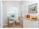 Bright dining area with a small table near the windows, seating for two and natural lighting at 14840 Shipwatch Trce # 1924, Largo, FL 33774