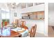 Inviting dining room with a wood table set for four, chandelier and open views to the kitchen at 14840 Shipwatch Trce # 1924, Largo, FL 33774