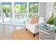 Relaxing sitting area with comfortable armchair and access to the outdoor patio area at 14840 Shipwatch Trce # 1924, Largo, FL 33774