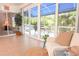 Relaxing sunroom with comfortable seating and large sliding doors with outdoor views at 14840 Shipwatch Trce # 1924, Largo, FL 33774