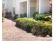 Picturesque walkway lined with lush greenery and charming details at 14840 Shipwatch Trce # 1924, Largo, FL 33774