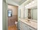 This bathroom features a single vanity, and combination shower and bath at 1521 Fireside St, Port Charlotte, FL 33952