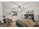 Inviting staged bedroom with a plush bed, soft lighting, and stylish decor for a relaxing retreat at 1521 Fireside St, Port Charlotte, FL 33952