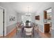 Traditional dining room with a chandelier, wood table, and seating for six at 1521 Fireside St, Port Charlotte, FL 33952