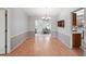 Clean dining room with wood floors, neutral walls, and an open layout to other rooms at 1521 Fireside St, Port Charlotte, FL 33952