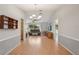 Spacious living room with neutral paint, vaulted ceilings, and wood laminate flooring at 1521 Fireside St, Port Charlotte, FL 33952