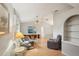 Bright living room featuring neutral paint, vaulted ceilings, and wood laminate floors at 1521 Fireside St, Port Charlotte, FL 33952