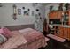 Cozy bedroom featuring a pink theme, dresser, and vintage hutch at 15625 Olney Ln, Spring Hill, FL 34610