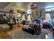Cozy bedroom features mirrored closet doors, a cushioned chest, and a plush rug at 15625 Olney Ln, Spring Hill, FL 34610