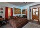 Bedroom with mirrored closet, vibrant decor, and an adjoining bathroom at 15625 Olney Ln, Spring Hill, FL 34610