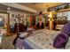 Bedroom with hardwood floors, mirrored closet doors, sitting area, and a doorway to the hall at 15625 Olney Ln, Spring Hill, FL 34610