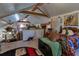 Spacious bedroom featuring a loft area and rustic decor adding to its unique charm and character at 15625 Olney Ln, Spring Hill, FL 34610