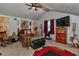 Charming bedroom with wood accents, comfortable furnishings, and a unique rocking horse at 15625 Olney Ln, Spring Hill, FL 34610