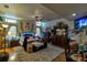 Bright bedroom with unique decorations, hardwood floors, a ceiling fan, and a plush rug at 15625 Olney Ln, Spring Hill, FL 34610