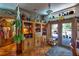 Dining area adjacent to the kitchen, featuring built-in storage and access to the patio at 15625 Olney Ln, Spring Hill, FL 34610