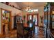 Inviting dining room with tiled flooring, classic chandelier, and doorway to the kitchen at 15625 Olney Ln, Spring Hill, FL 34610
