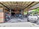 Spacious garage with vehicles and equipment, offering ample space for projects and storage at 15625 Olney Ln, Spring Hill, FL 34610