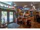 Open kitchen with breakfast bar, stainless appliances, and access to outdoor patio at 15625 Olney Ln, Spring Hill, FL 34610