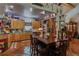 Rustic kitchen featuring custom wood cabinets, tile floor, and stainless steel appliances at 15625 Olney Ln, Spring Hill, FL 34610